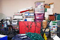 A garage cluttered with items that should go into storage A garage cluttered with items that should go into storage